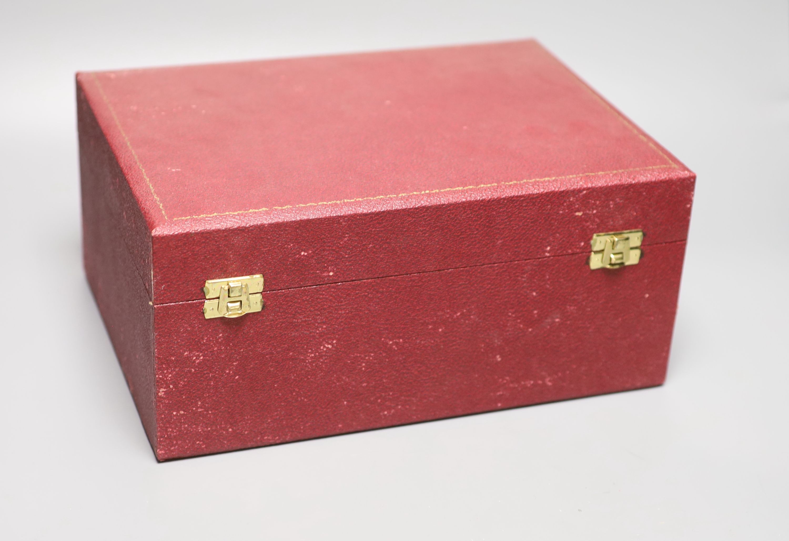 A pair of George II style silver presentation candlesticks, weighted, London 1986, David Shaw Silverware Ltd, in fitted case
